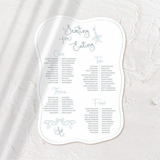 Elegant organic-shaped seating chart with delicate script, perfect for a romantic wedding.