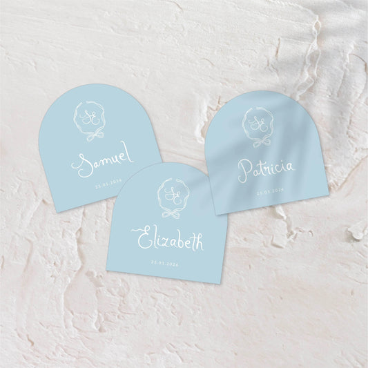 Custom-shaped blue acrylic coaster with elegant white script.