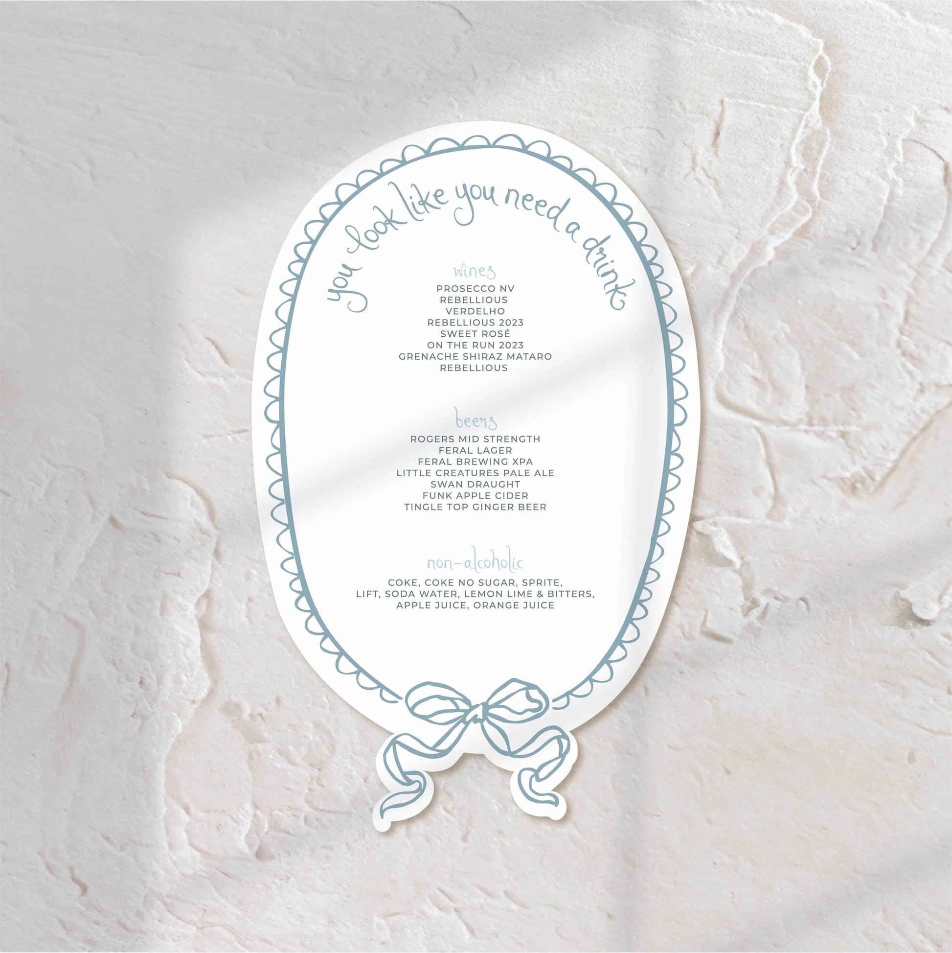 Oval-shaped bar menu with elegant blue accents