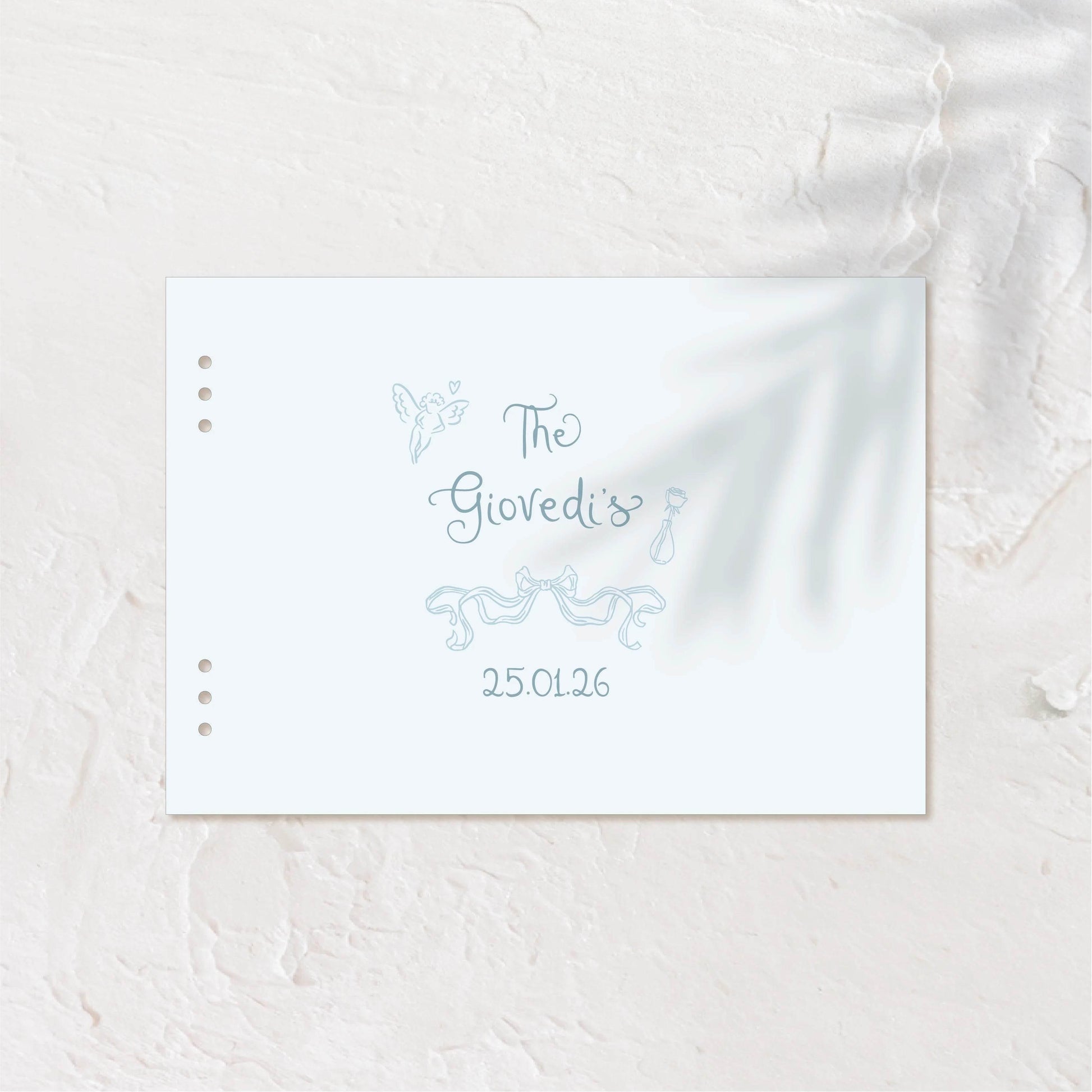 Softly styled guest book cover with gentle palm shadows and simple design.