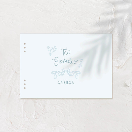 Softly styled guest book cover with gentle palm shadows and simple design.