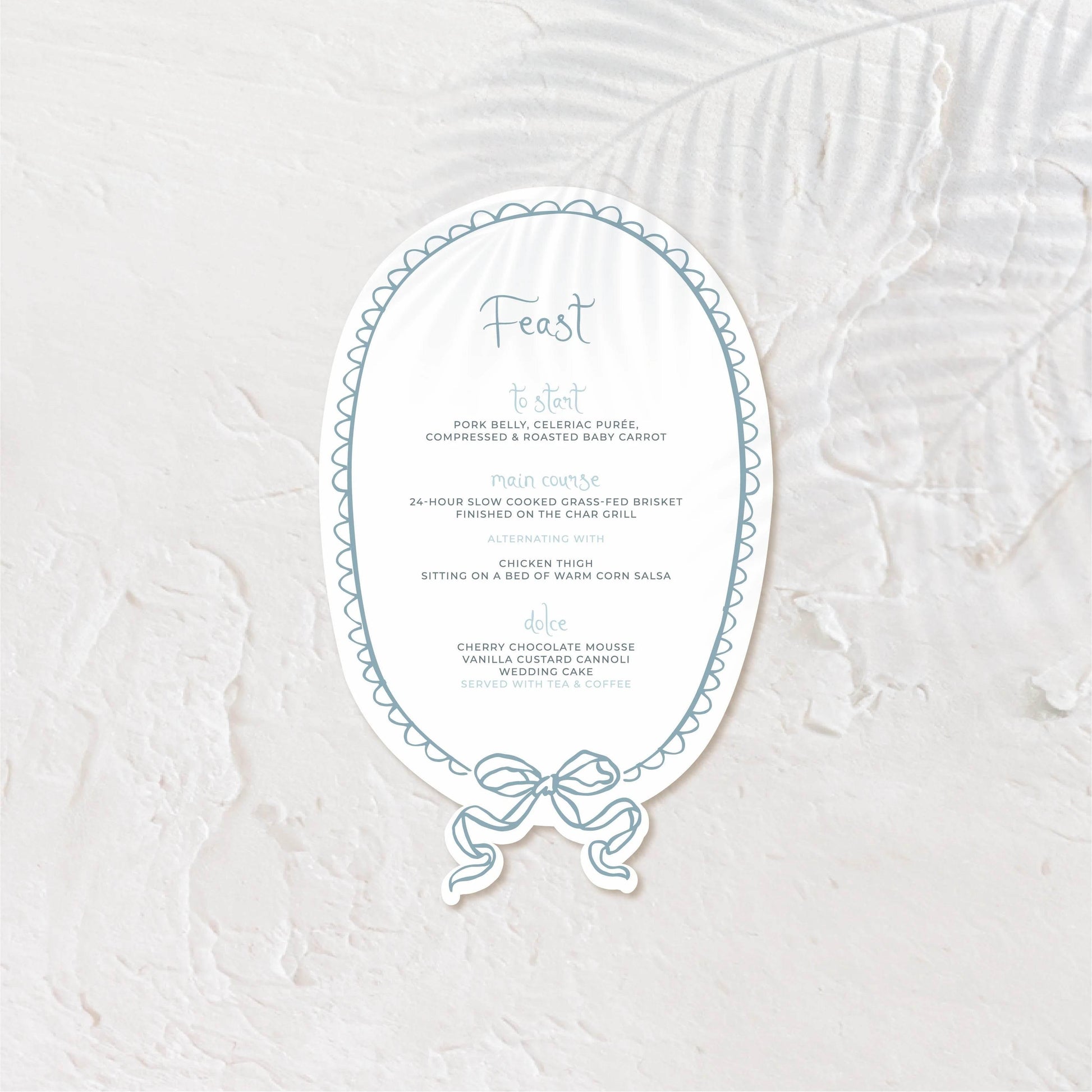 Oval-shaped wedding menu with romantic type and soft greyscale tones.