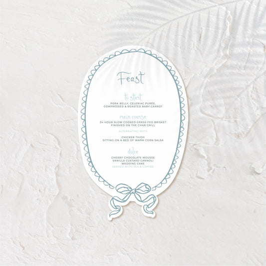 Oval-shaped wedding menu with romantic type and soft greyscale tones.