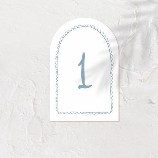 Arch-shaped table number card with minimalist design and number "1" in blue.