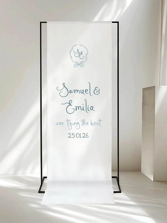 Soft fabric welcome sign displayed on a modern black frame with minimalist design.