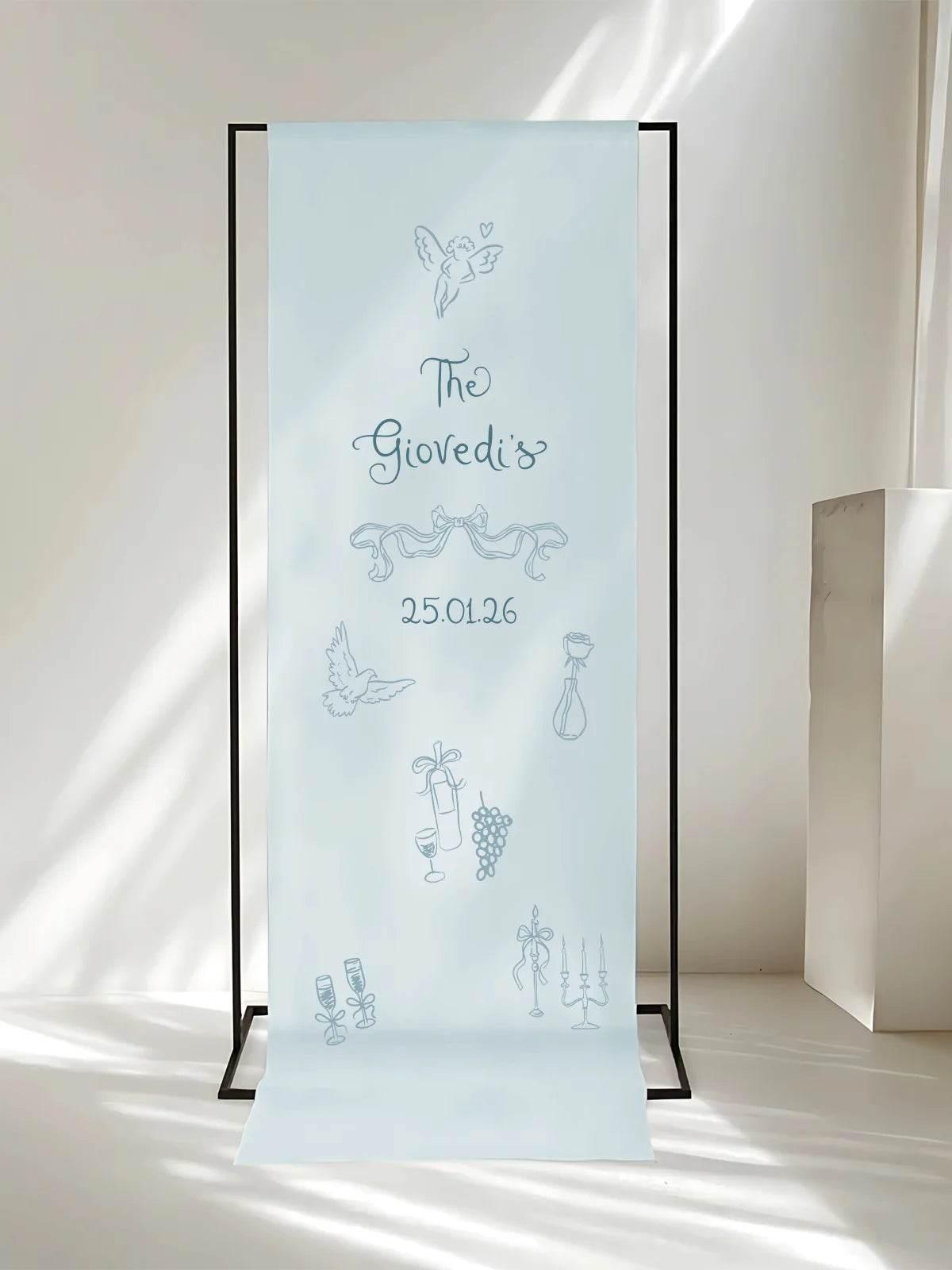 Fabric wedding welcome sign, featuring a minimalist design and soft blue tones in natural light.