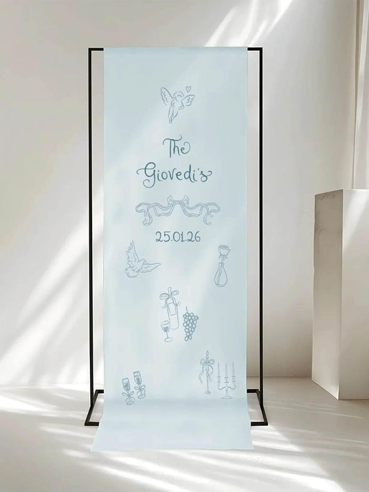 Fabric wedding welcome sign, featuring a minimalist design and soft blue tones in natural light.