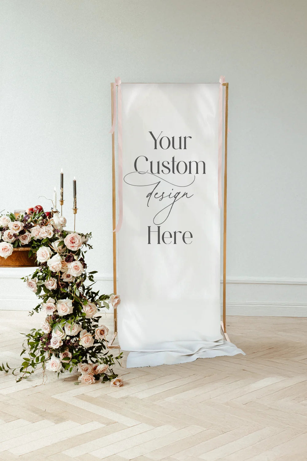 Decorative linen banner from the wedding with 'Your Custom Design Here' text in a room with floral arrangements.